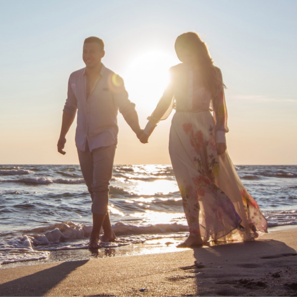 Couple in love walking on the beach